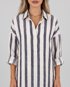 Close-up of the striped shirt dress collar, V-neckline and rolled-up sleeves