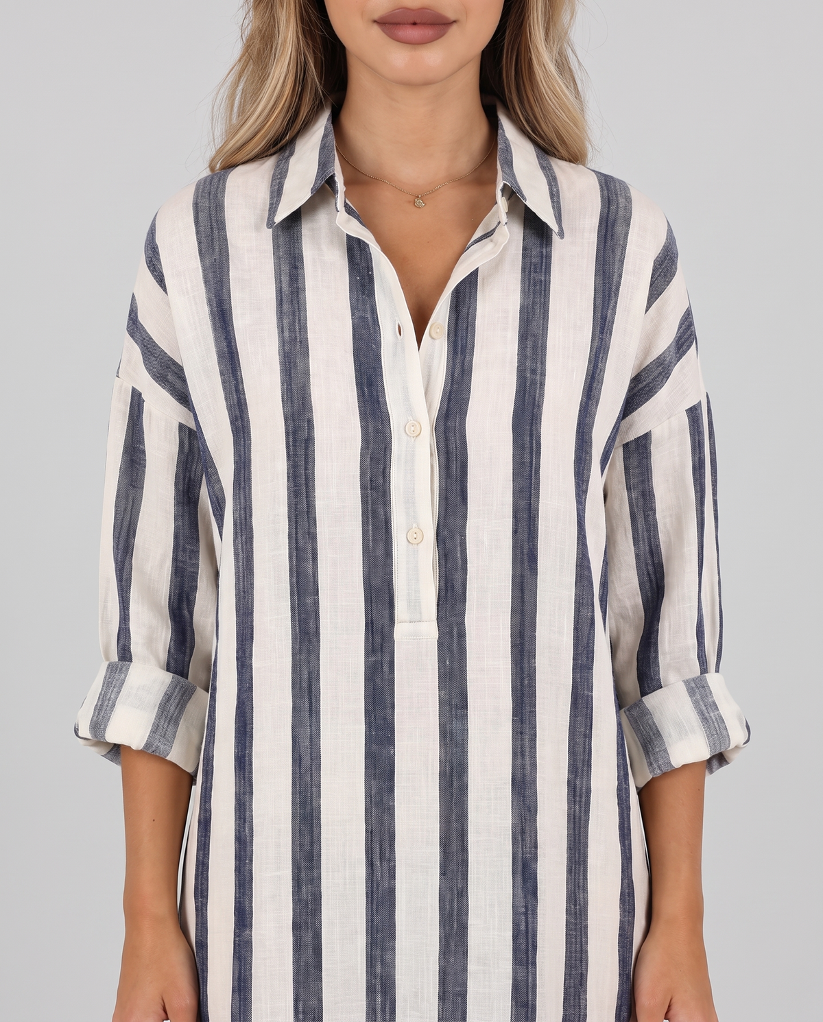 Close-up of the striped shirt dress collar, V-neckline and rolled-up sleeves