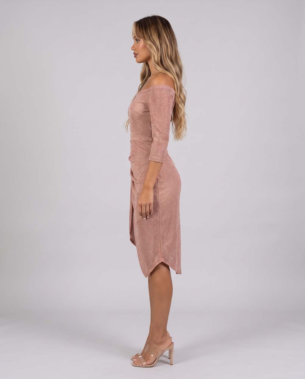 Champagne off-shoulder wrap midi dress, side view showing the asymmetric hem