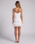 White sequin fringe mini dress with feather hem, back view