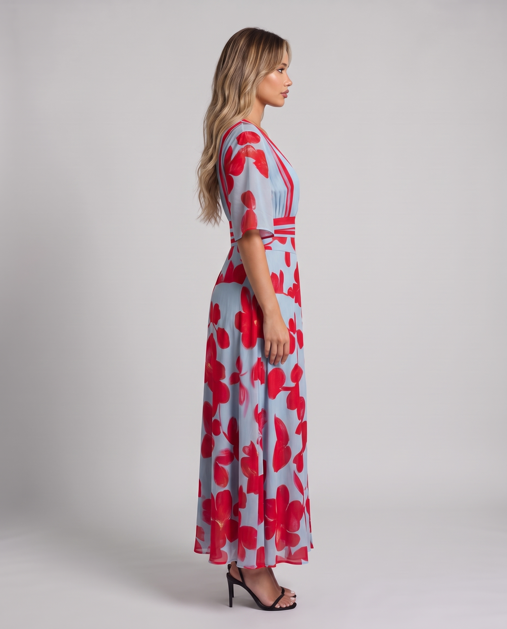 Light blue and red floral maxi dress with V-neckline, flared half sleeves and striped waistband, side view