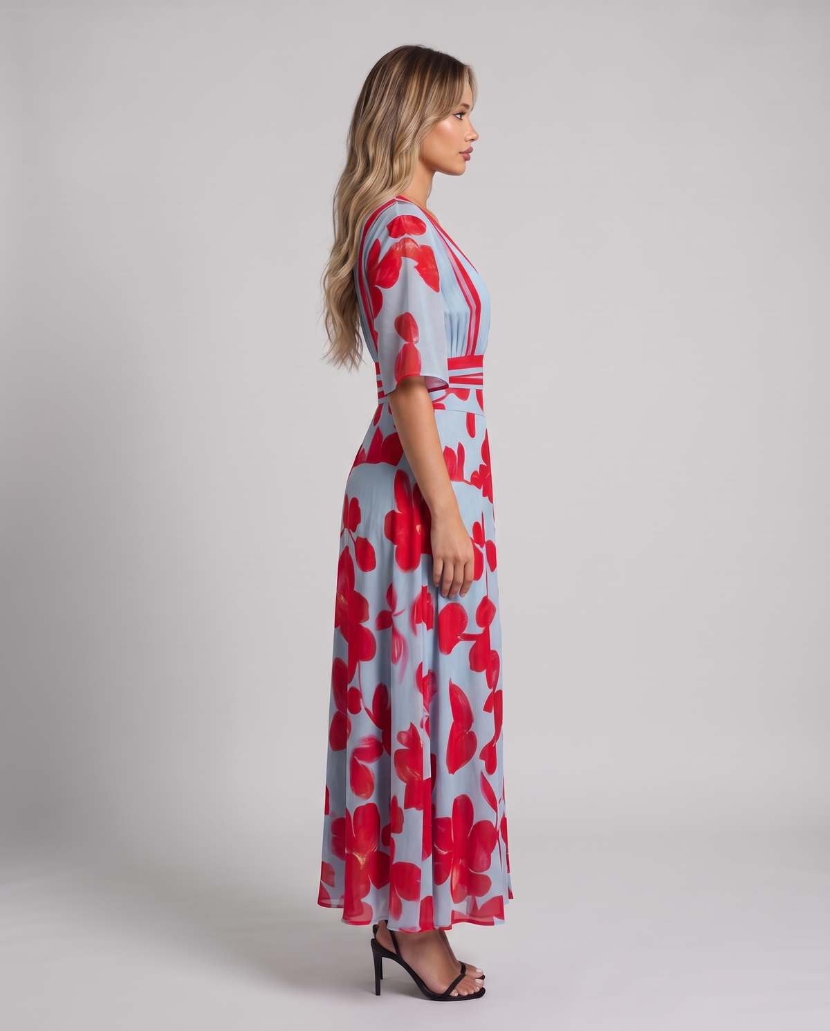 Light blue and red floral maxi dress with V-neckline, flared half sleeves and striped waistband, side view