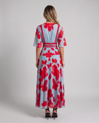 Light blue and red floral maxi dress, back view showing the V-back with red trim