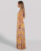 Yellow and lilac floral pleated maxi evening gown, side view showing the floor-length pleated skirt