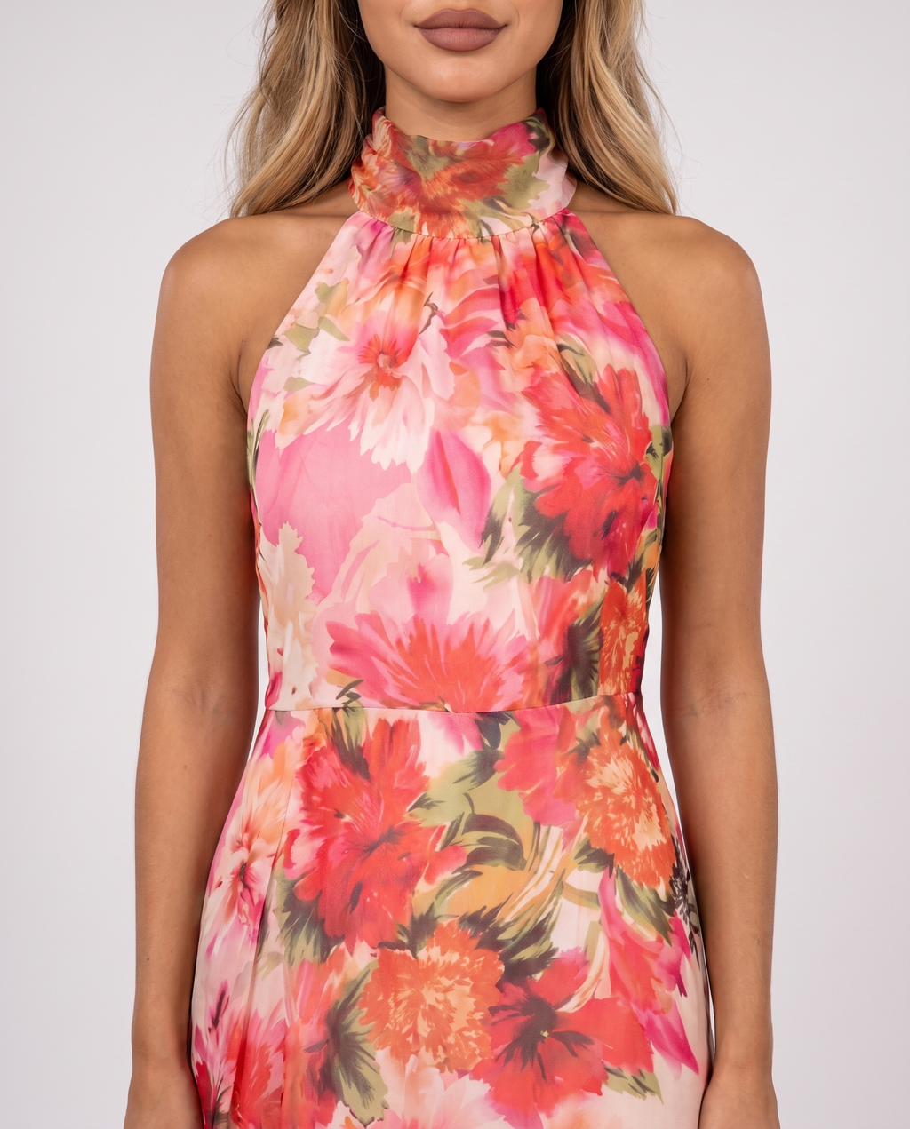 Close-up of the draped halter neckline and floral chiffon print