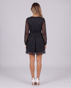 Black glitter mini dress, back view